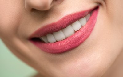 Woman With Red Lipstick and White Teeth Smiling