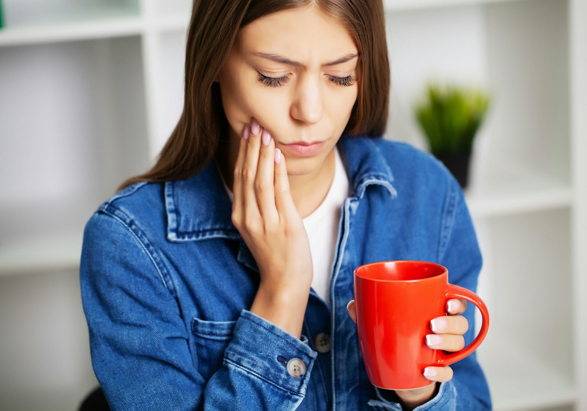 woman suffering from tooth cavities
