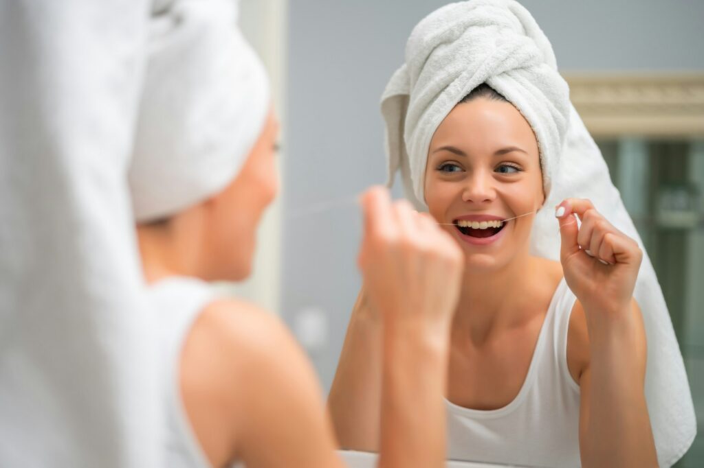 Cleaning teeth with dental floss