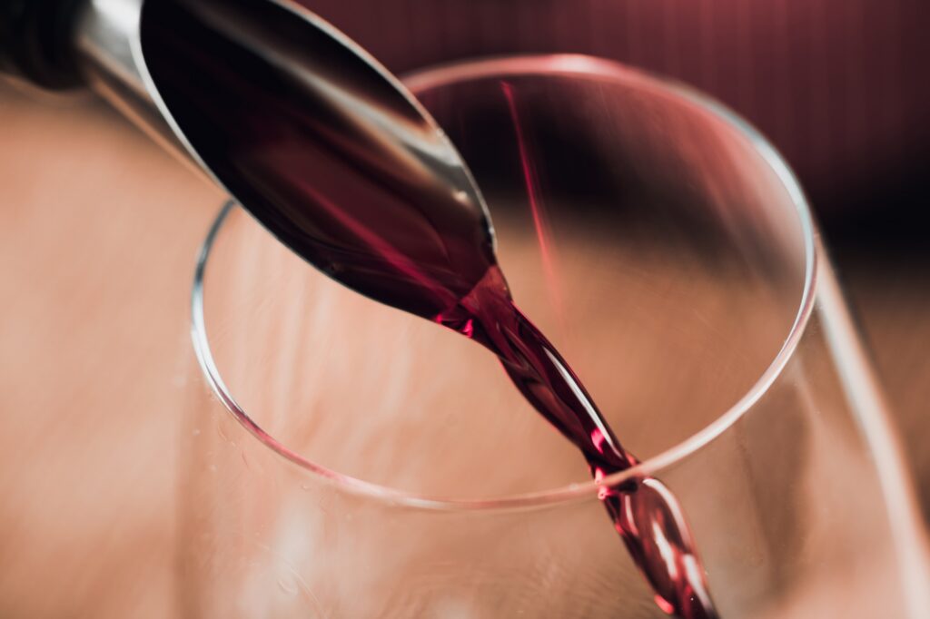 Red Wine Pouring Into Wine Glass